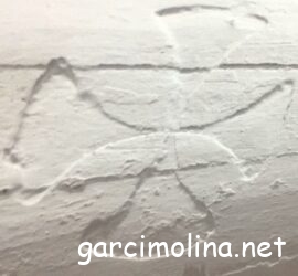 Cruces en vigas de techo en Garcimolina